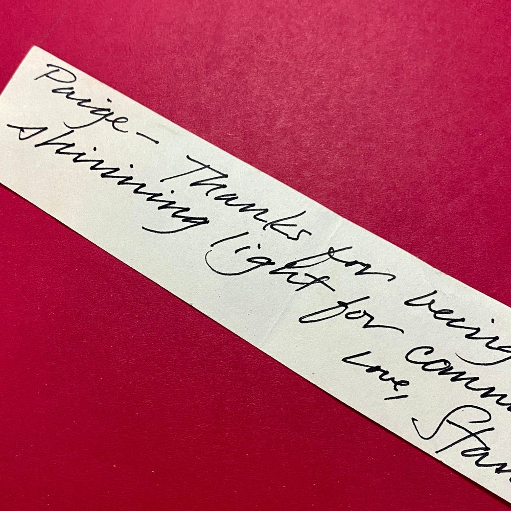 A handwritten note on a red background: “Paige, thanks for being a shining light”